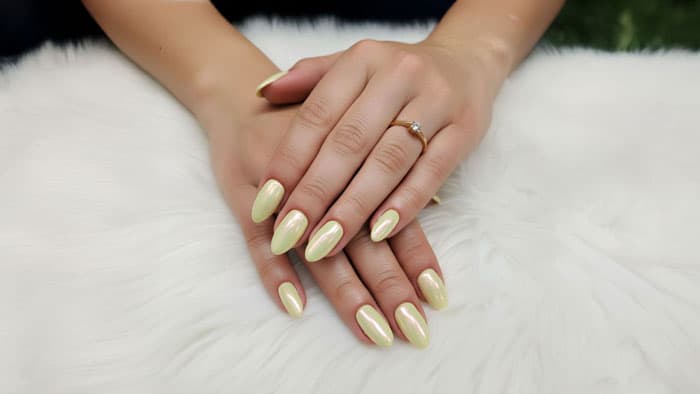 Lumé menu with polish, prosecco, and orchid on marble